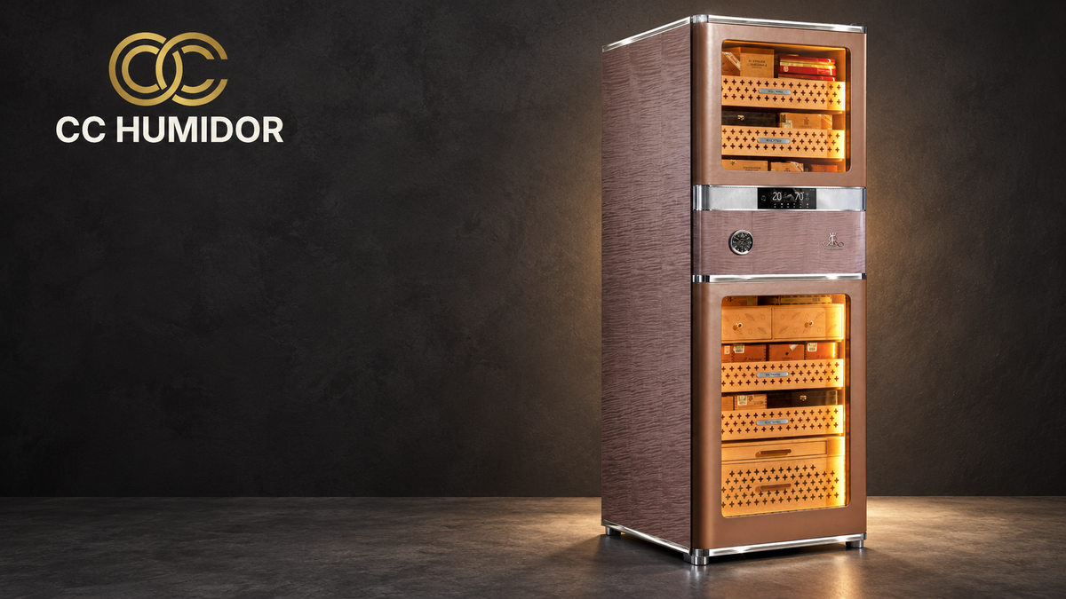 Raching RR980 Havana Tan cabinet in an editorial studio composition with the official CC Humidor double-C logo.